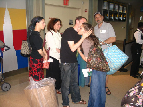 Parting. A family says goodbye at the security checkpoint. 