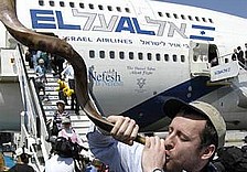 A man blows the shofar after...