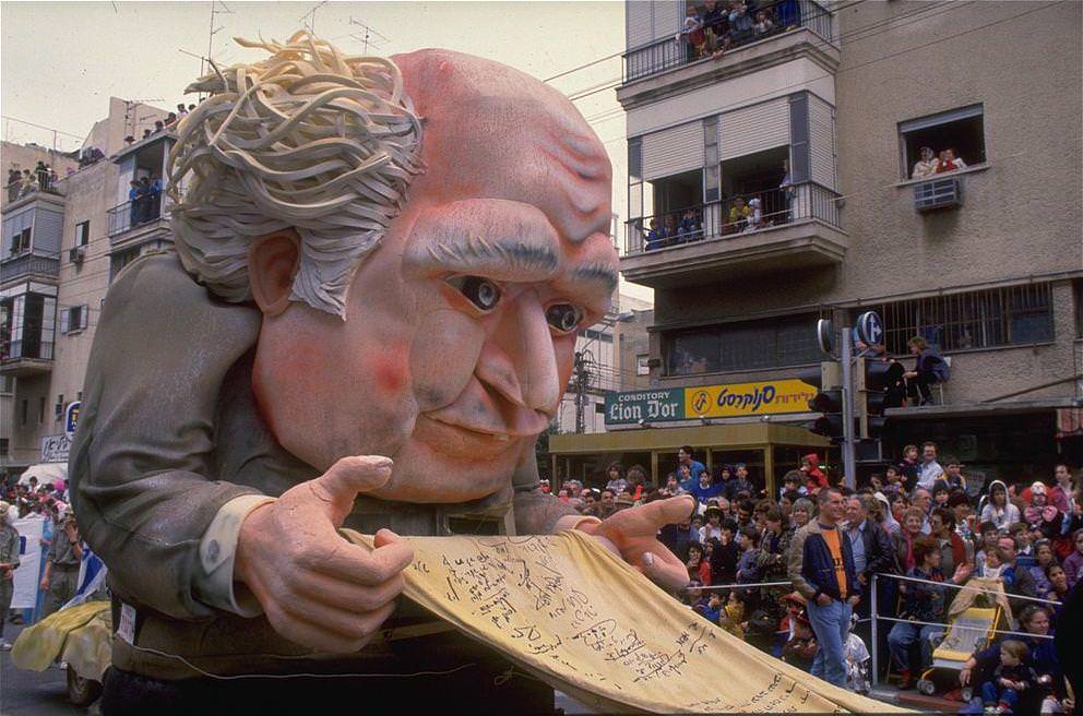 A giant Ben-Gurion doll is paraded at an Adloyada parade