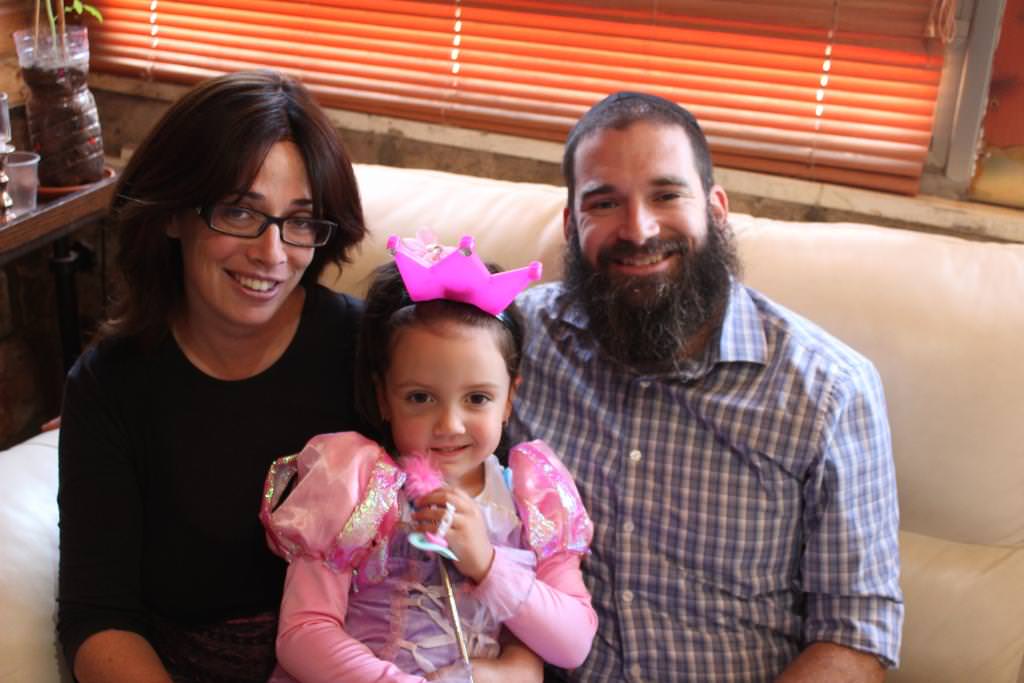 “I wouldn’t pick any city over Tzfat,” says Chana Tibor, shown with husband Yehoshua and daughter Moussia. (Photo credit: Hillel Kuttler)